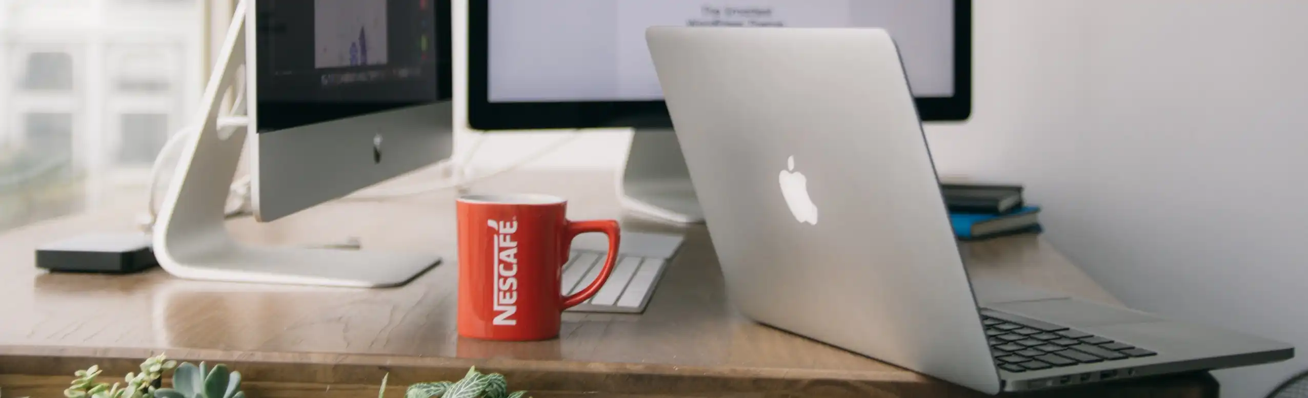 iMac iPhone and Cup of Nescafe